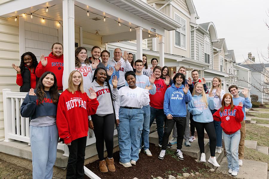 ${ Students in the student neighborhood with President Spina }